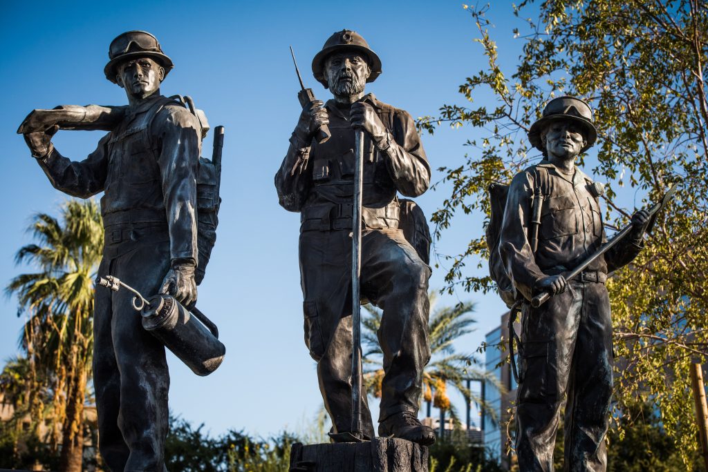 Bronze firefighters sculptures installed at the Phoenix, Arizona Fallen Firefighter Memorial by Paul Olesniewicz