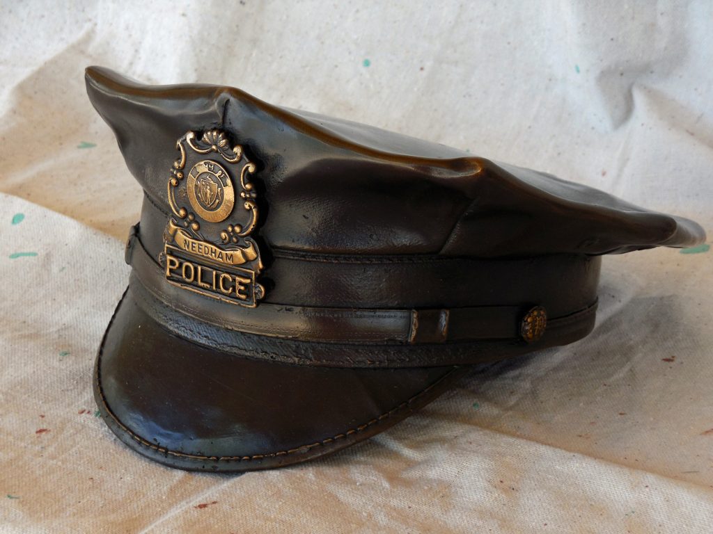Bronze life size Police Officer Urn Classic Cap Sculpture in Needham, Massachusetts by Paul Olesniewicz
